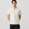 Polo tričko s monogramovou sponou Polo tričko s monogramovou sponou