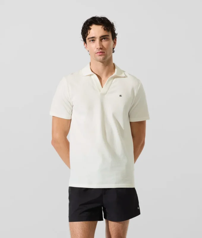 Polo tričko s monogramovou sponou Polo tričko s monogramovou sponou