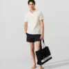 Polo tričko s monogramovou sponou Polo tričko s monogramovou sponou